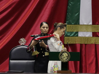 Claudia Sheinbaum (off-white dress), president of Mexico, receives the presidential sash in Mexico City, Mexico, on October 1, 2024, at the...