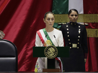 Claudia Sheinbaum (off-white dress), president of Mexico, in Mexico City, Mexico, on October 1, 2024, at the Chamber of Deputies, after rece...