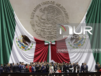 Claudia Sheinbaum (off-white dress), president of Mexico, in Mexico City, Mexico, on October 1, 2024, at the Chamber of Deputies, after rece...