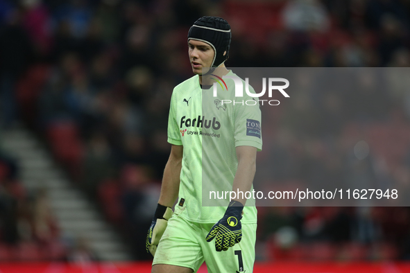 Derby County goalkeeper Jacob Widell Zetterstrom shows dejection while wearing head protection during the Sky Bet Championship match between...