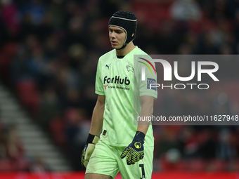 Derby County goalkeeper Jacob Widell Zetterstrom shows dejection while wearing head protection during the Sky Bet Championship match between...