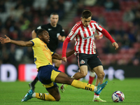 Derby County's Ryan Nyambe tackles Sunderland's Nazariy Rusyn during the Sky Bet Championship match between Sunderland and Derby County at t...