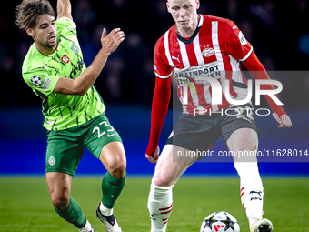 Sporting Club Portugal midfielder Daniel Braganca and PSV Eindhoven midfielder Jerdy Schouten play during the match PSV vs. Sporting CP at t...