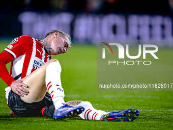 PSV Eindhoven defender Rick Karsdorp gets injured during the match between PSV and Sporting CP at the Philips Stadium for the UEFA Champions...