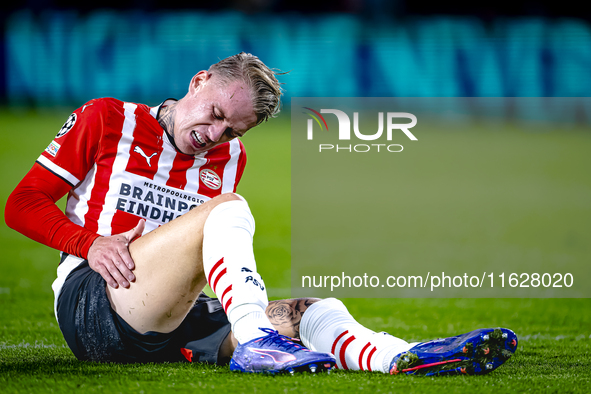 PSV Eindhoven defender Rick Karsdorp gets injured during the match between PSV and Sporting CP at the Philips Stadium for the UEFA Champions...