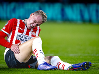 PSV Eindhoven defender Rick Karsdorp gets injured during the match between PSV and Sporting CP at the Philips Stadium for the UEFA Champions...