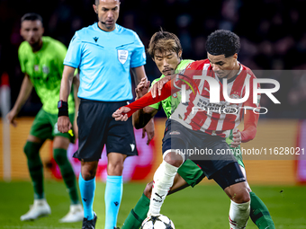 Sporting Club Portugal midfielder Hidemasa Morita and PSV Eindhoven midfielder Malik Tillman during the match PSV vs. Sporting CP at the Phi...