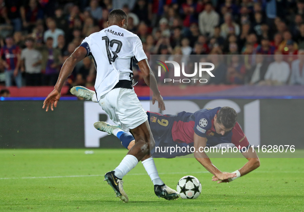 Robert Lewandowski and Mohamed Camara play during the match between FC Barcelona and BSC Young Boys in the week 2 of the League Stage of the...