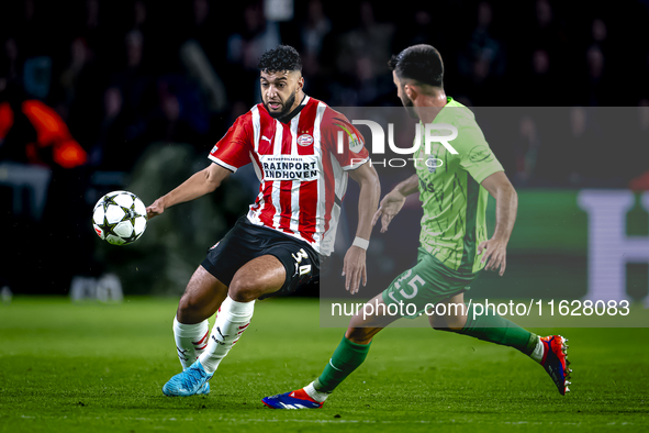 PSV Eindhoven midfielder Ismael Saibari and Sporting Club Portugal defender Goncalo Inacio during the match between PSV and Sporting CP at t...