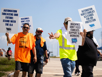 Dockworkers and their supporters hold signs during a strike outside the Bayport Container Terminal in Seabrook, Texas, on October 1, 2024. (