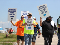 Dockworkers and their supporters hold signs during a strike outside the Bayport Container Terminal in Seabrook, Texas, on October 1, 2024. (