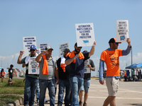 Dockworkers and their supporters hold signs during a strike outside the Bayport Container Terminal in Seabrook, Texas, on October 1, 2024. (