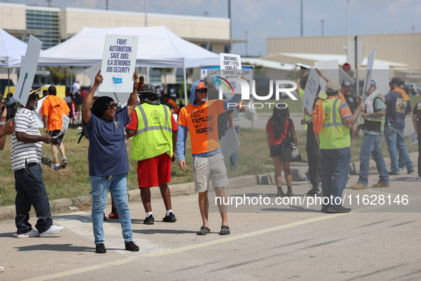 Dockworkers and their supporters hold signs during a strike outside the Bayport Container Terminal in Seabrook, Texas, on October 1, 2024. 