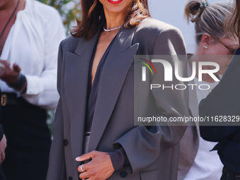 Zoe Saldana arrives at the photocall of Emilia Perez in Cannes, France, on May 19, 2024, during the 77th Festival de Cannes (