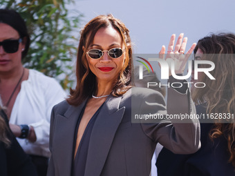 Zoe Saldana arrives at the photocall of Emilia Perez in Cannes, France, on May 19, 2024, during the 77th Festival de Cannes (