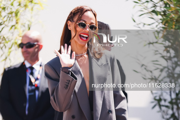 Zoe Saldana arrives at the photocall of Emilia Perez in Cannes, France, on May 19, 2024, during the 77th Festival de Cannes 