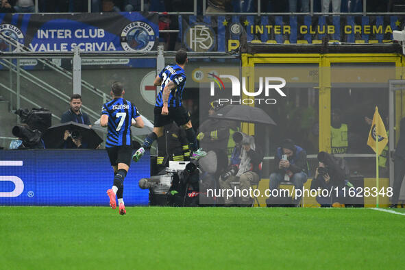 Hakan Calhanoglu of F.C. Inter celebrates after scoring the goal of 1-0 during the UEFA Champions League 2024/25 League Phase MD2 match betw...