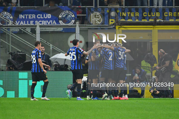 Hakan Calhanoglu of F.C. Inter celebrates after scoring the goal of 1-0 during the UEFA Champions League 2024/25 League Phase MD2 match betw...