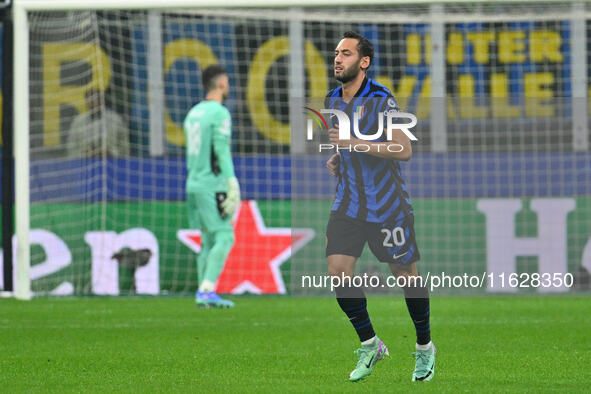 Hakan Calhanoglu of F.C. Inter celebrates after scoring the goal of 1-0 during the UEFA Champions League 2024/25 League Phase MD2 match betw...