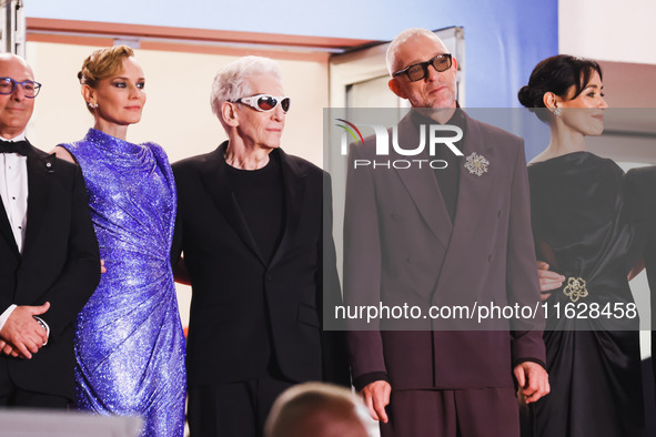 Diane Kruger, Vincent Cassel, and David Cronenberg attend the red carpet for the premiere of The Shrouds during the 77th Festival de Cannes...