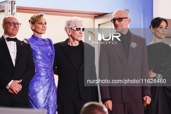 Diane Kruger, Vincent Cassel, and David Cronenberg attend the red carpet for the premiere of The Shrouds during the 77th Festival de Cannes...