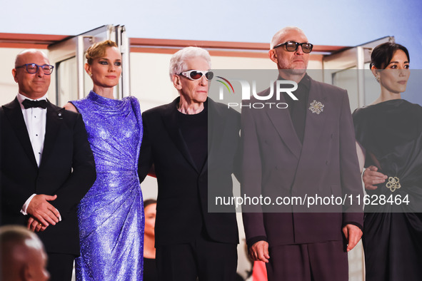 Diane Kruger, Vincent Cassel, and David Cronenberg attend the red carpet for the premiere of The Shrouds during the 77th Festival de Cannes...