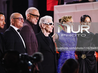 Diane Kruger, Vincent Cassel, and David Cronenberg attend the red carpet for the premiere of The Shrouds during the 77th Festival de Cannes...