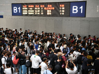 A large number of passengers wait in the waiting room of Nanchang Railway Station in Nanchang, China, on October 1, 2024. (