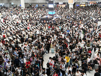 A large number of passengers wait in the waiting room of Nanchang Railway Station in Nanchang, China, on October 1, 2024. (