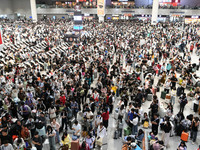 A large number of passengers wait in the waiting room of Nanchang Railway Station in Nanchang, China, on October 1, 2024. (