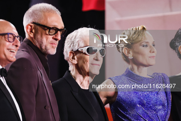 Diane Kruger, Vincent Cassel, and David Cronenberg attend the red carpet for the premiere of The Shrouds during the 77th Festival de Cannes...