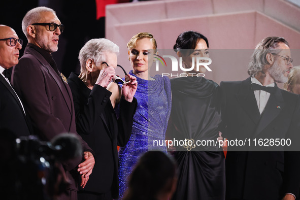 Diane Kruger, Vincent Cassel, and David Cronenberg attend the red carpet for the premiere of The Shrouds during the 77th Festival de Cannes...