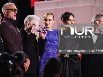 Diane Kruger, Vincent Cassel, and David Cronenberg attend the red carpet for the premiere of The Shrouds during the 77th Festival de Cannes...