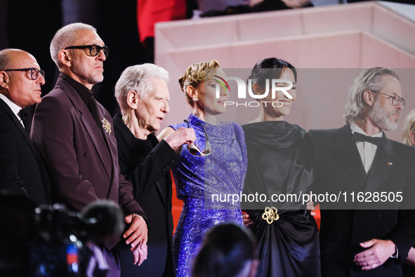 Diane Kruger, Vincent Cassel, and David Cronenberg attend the red carpet for the premiere of The Shrouds during the 77th Festival de Cannes...