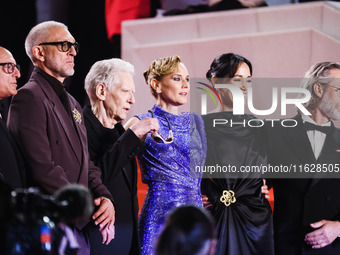 Diane Kruger, Vincent Cassel, and David Cronenberg attend the red carpet for the premiere of The Shrouds during the 77th Festival de Cannes...