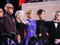 Diane Kruger, Vincent Cassel, and David Cronenberg attend the red carpet for the premiere of The Shrouds during the 77th Festival de Cannes...