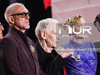 Diane Kruger, Vincent Cassel, and David Cronenberg attend the red carpet for the premiere of The Shrouds during the 77th Festival de Cannes...