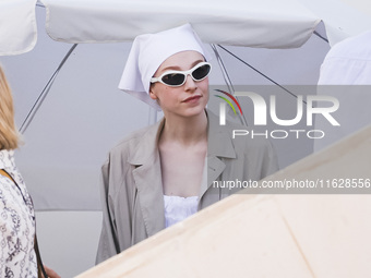 Hunter Schafer arrives at the photocall of Kinds of Kindness during the 77th Festival de Cannes in Cannes, France, on May 18, 2024 (