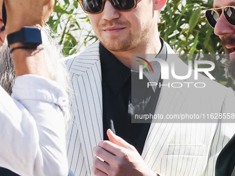 Joe Alwyn arrives at the photocall of Kinds of Kindness during the 77th Festival de Cannes in Cannes, France, on May 18, 2024 (