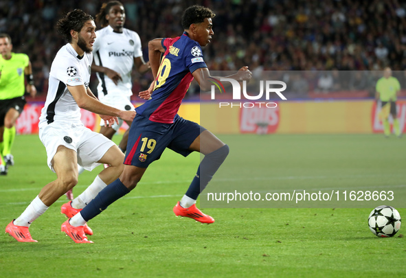 Lamine Yamal and Jaouen Hadjam play during the match between FC Barcelona and BSC Young Boys in the week 2 of the League Stage of the UEFA C...