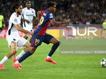 Lamine Yamal and Jaouen Hadjam play during the match between FC Barcelona and BSC Young Boys in the week 2 of the League Stage of the UEFA C...