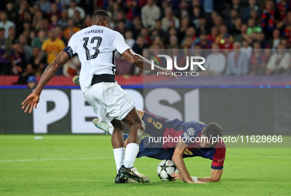 Robert Lewandowski and Mohamed Camara play during the match between FC Barcelona and BSC Young Boys in the week 2 of the League Stage of the...