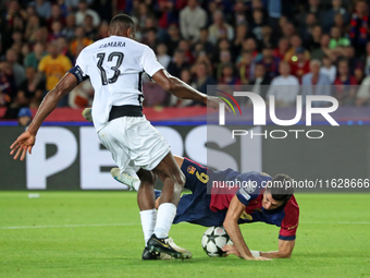 Robert Lewandowski and Mohamed Camara play during the match between FC Barcelona and BSC Young Boys in the week 2 of the League Stage of the...