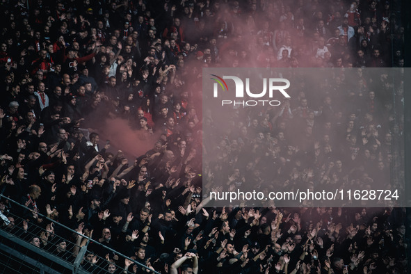 Fans of AC Milan are seen during the UEFA Champions League 2024/25 League Phase MD2 match between Bayer 04 Leverkusen and AC Milan at BayAre...