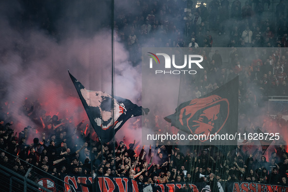 Fans of AC Milan are seen during the UEFA Champions League 2024/25 League Phase MD2 match between Bayer 04 Leverkusen and AC Milan at BayAre...