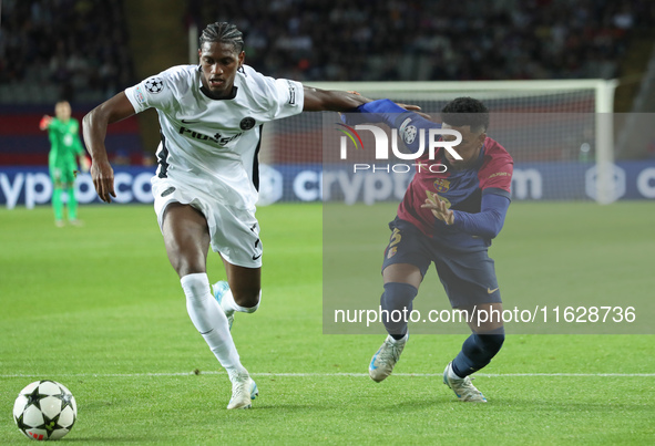 Alejandro Balde and Ebrima Colley play during the match between FC Barcelona and BSC Young Boys in the week 2 of the League Stage of the UEF...