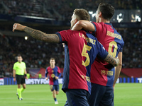 Inigo Martinez and Robert Lewandowski celebrate a goal during the match between FC Barcelona and BSC Young Boys in the week 2 of the League...