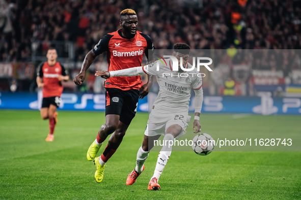 Victor Boniface of Bayer 04 Leverkusen and Emerson of AC Milan are in action during the UEFA Champions League 2024/25 League Phase MD2 match...