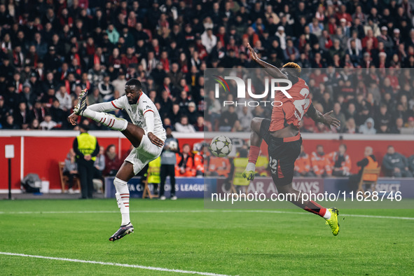 Victor Boniface of Bayer 04 Leverkusen and Fikayo Tomori of AC Milan are in action during the UEFA Champions League 2024/25 League Phase MD2...