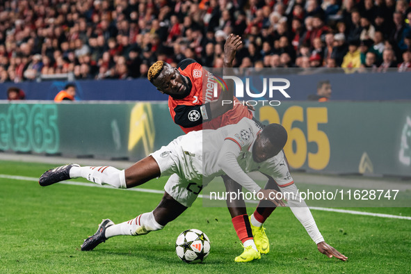 Victor Boniface of Bayer 04 Leverkusen and Fikayo Tomori of AC Milan are in action during the UEFA Champions League 2024/25 League Phase MD2...